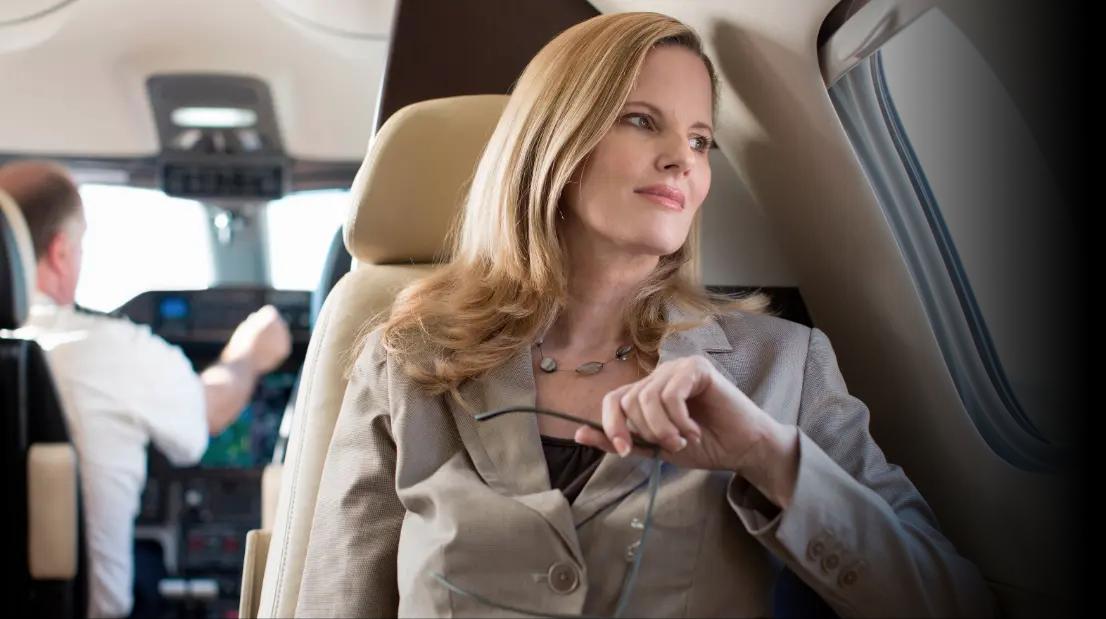 Woman sitting on plane.